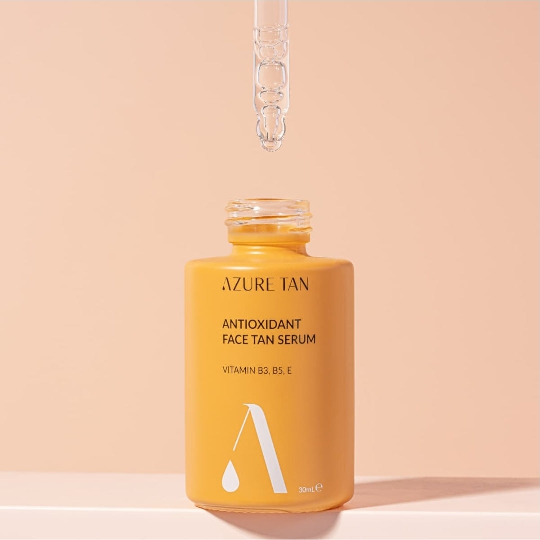 Azure Tan antioxidant face tan serum bottle with dropper on a beige background