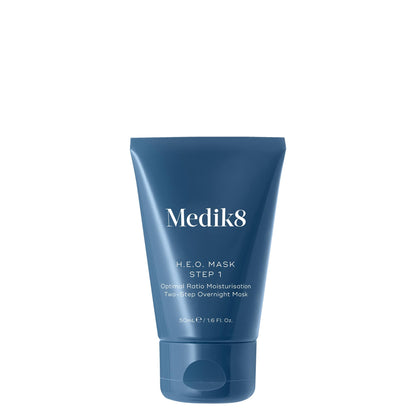 Blue tube of Medik8 H.E.O. MASK step 1 skincare product on a white background
